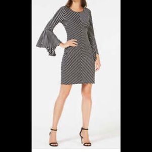 INC Dress Bell sleeves. V back ties with a  bow knee/right above knee length